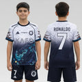 Child wearing a sports jersey with 'KAFD' and 'Adidas' branding Dragon kit, front and back views.