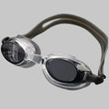Swimming goggles with black lenses and gray straps on a light gray background