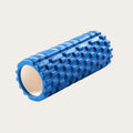Blue foam roller on a light gray background
