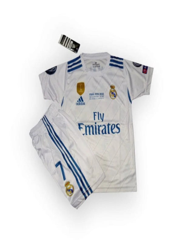 Folded sports jersey with Adidas and Real Madrid logos on a white background
