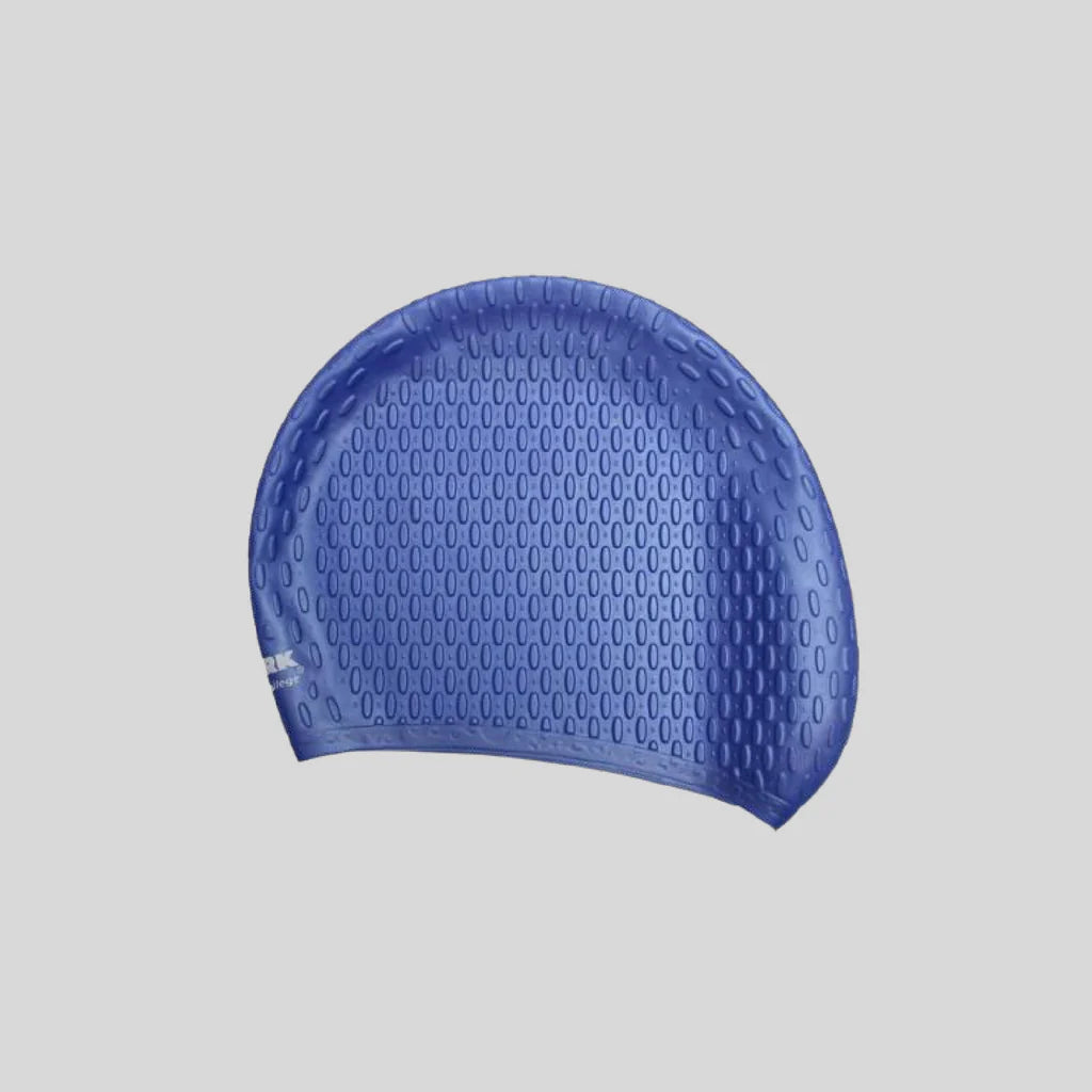 Blue swim cap with textured surface on a light gray background