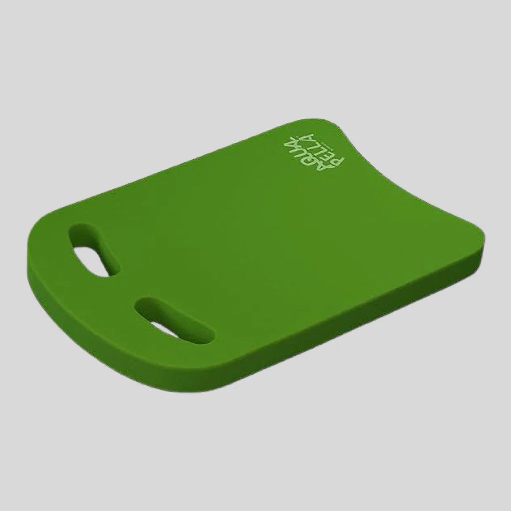 Green foam block with cutouts on a gray background