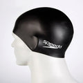 Black swim cap with Speedo logo on a mannequin head against a white background