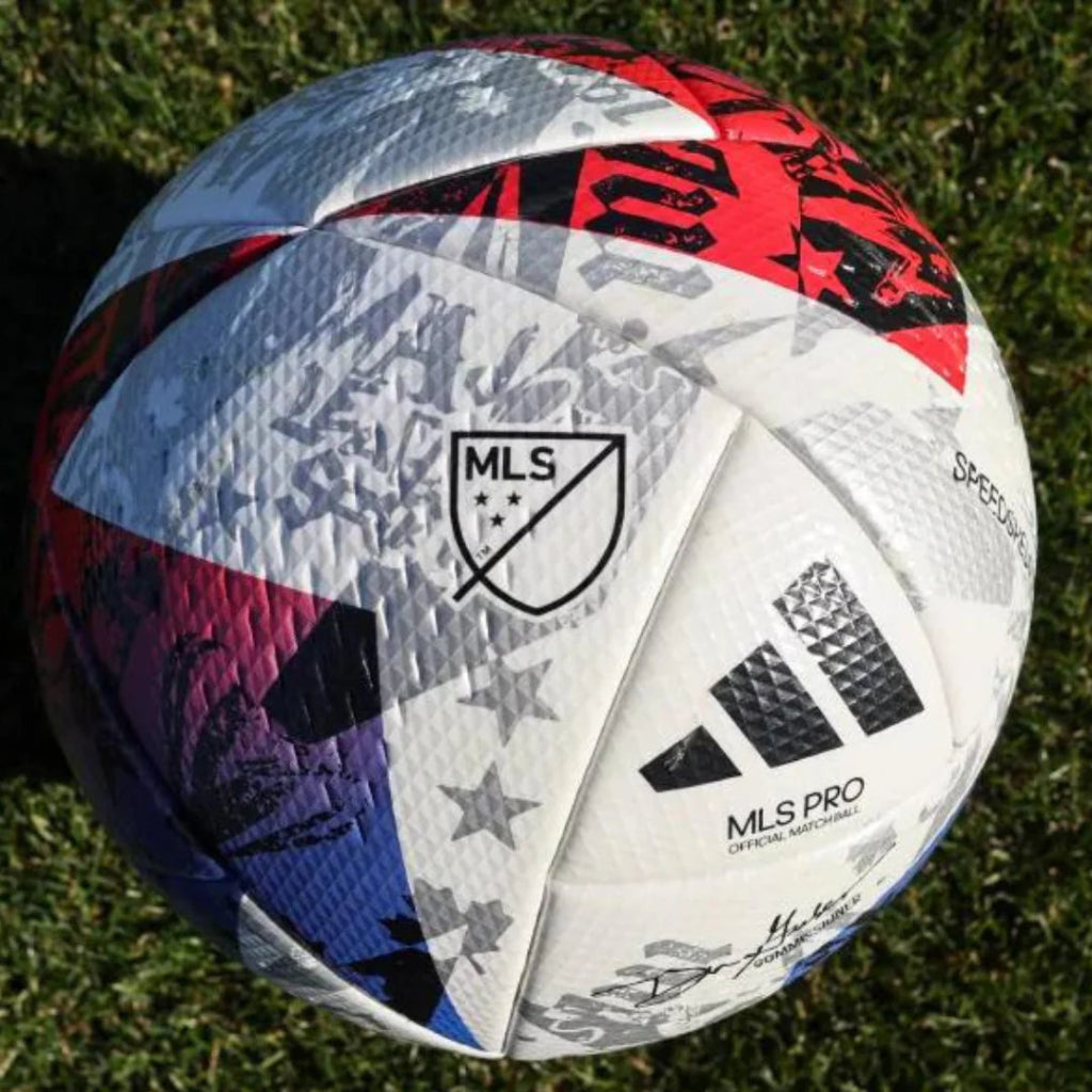 Colorful soccer ball with MLS logo on a grass field
