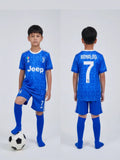 Child wearing a blue soccer jersey with 'Jeep' and 'Ronaldo 7' branding, standing next to a soccer ball.