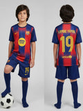 Child wearing a Barcelona soccer jersey with 'Lamine Yamal' and number '19', standing next to a soccer ball.