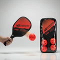 Pickleball paddle with red balls on a gray background