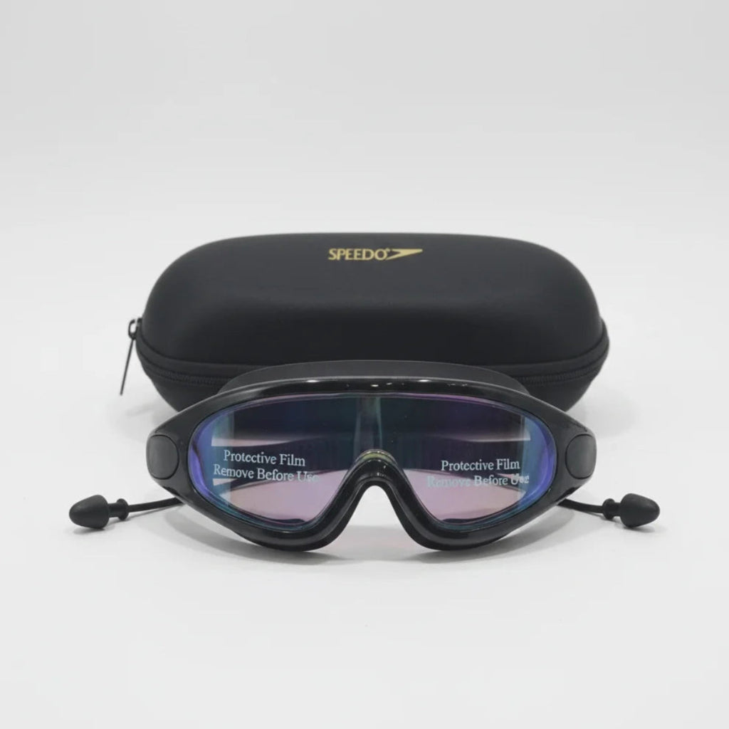 Black swim goggles with protective film on a white background, featuring Speedo branding.